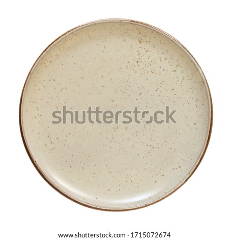 Empty plate top isolated on white background. Round brown rustic dish above view Royalty-Free Stock Photo #1715072674