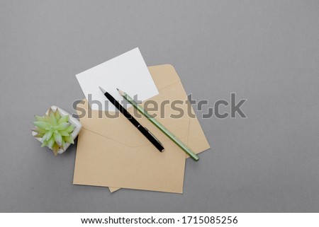 Stationary concept, Flat Lay top view Photo of pencil, pen  and notepad  on a pink abstract background with copy space, minimal 
