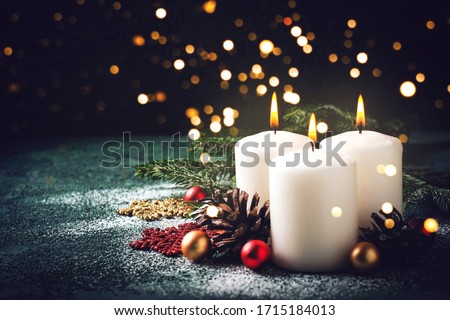 Christmas card with holiday mood. Festive burning candles. Natural and reusable decor.