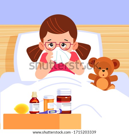 Sick cute girl blowing her nose and covering it with handkerchief. Small ill sad child with a flu, sneezing. There are medicines and a thermometer by the bed. Cartoon style vector illustration.