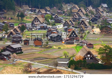 Shirakawa-go village aerial view, Japan. Landmark village with wooden homes and thatched roofs listed as UNESCO site.