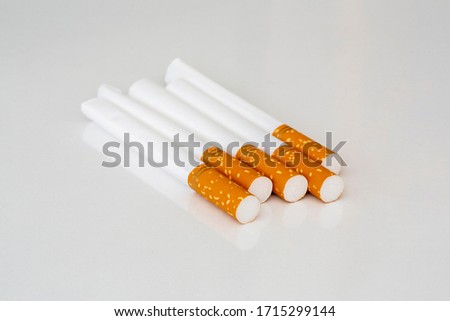 Close up of a smoking cigarettes on isolated background