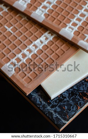 Ceramic tile close-up. A detailed shot of four ceramic tiles. Front and Back of ceramic tiles for walls and floors. Building materials. Selective focus.