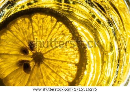 a slice of lemon in a Cup with a drink