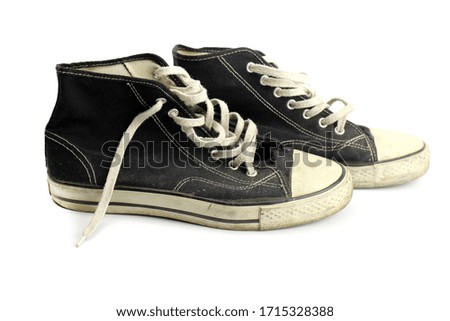 Old grunge sneakers isolated on white