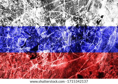Russian flag on breaking glass texture. The concept of crisis, default, economic collapse, pandemic, conflict, terrorism or other problems in the country. Abstract disaster symbol.