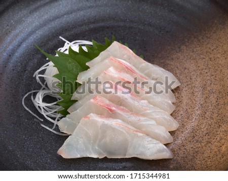 Red sea bream sashimi on a plate. Royalty-Free Stock Photo #1715344981