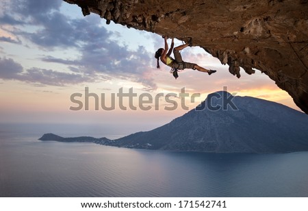 Young female rock climber at sunset, Kalymnos Island, Greece  Royalty-Free Stock Photo #171542741