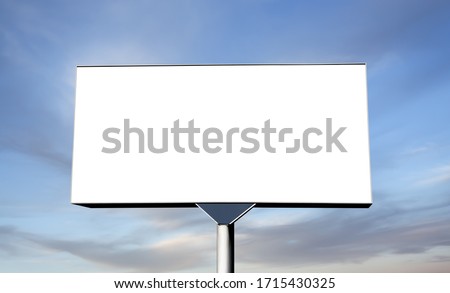 Blank billboard on sky background ready for new advertisement. Billboard with space for your advertisement against blue sky