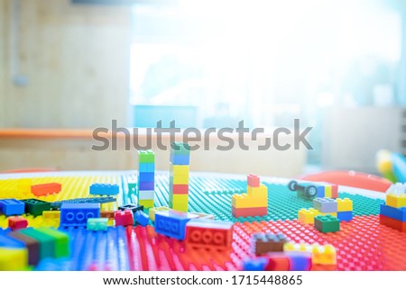Colorful plastic bricks table for learning and development.