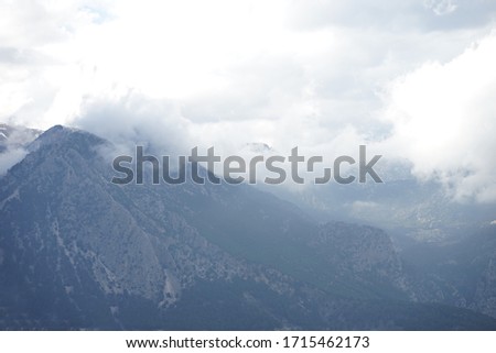  mountain view with snow and large clouds
