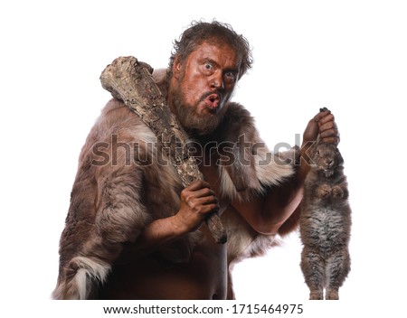 Neanderthal man, Ice Age, caveman with a hare Royalty-Free Stock Photo #1715464975