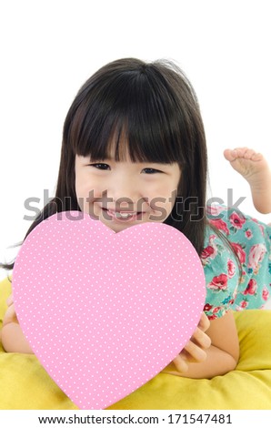 Portrait of asian cute child with pink box heart .