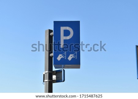 Paid parking sign, on metal pole Dutch, white P on blue background