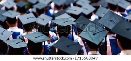 Large group of graduation caps during commencement. Royalty-Free Stock Photo #1715508049