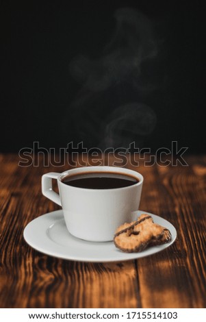 This picture shows a fresh brewed steaming coffee 