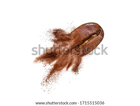 Creative picture from flying coffee bean with powder explosion on a white background, copy space.