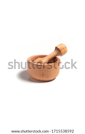 wooden mortar with pestle isolated on a white background. Photography for catalog design, advertising, printing, web
