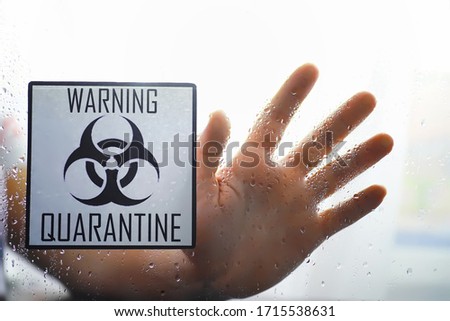 Quarantine. Quarantine warning sign on a glass door in hospital isolator. Isolation of patients with the virus in special laboratories. Virus.