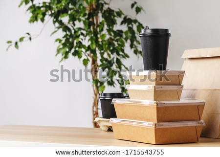 Assortment of various food delivery containers on table close up