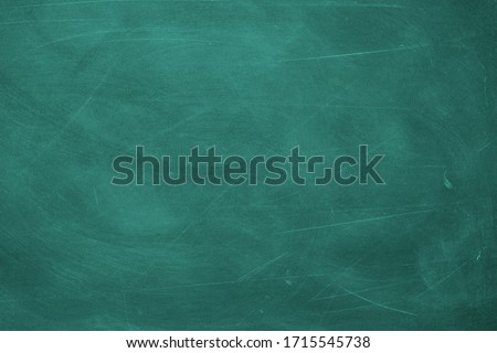 Abstract texture of chalk rubbed out on green blackboard or chalkboard background. School education, dark wall backdrop or learning concept. Royalty-Free Stock Photo #1715545738