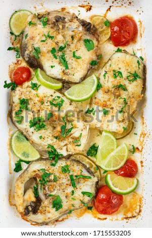 Homemade cod in butter sauce, with lime, tomato, parsley and garlic.