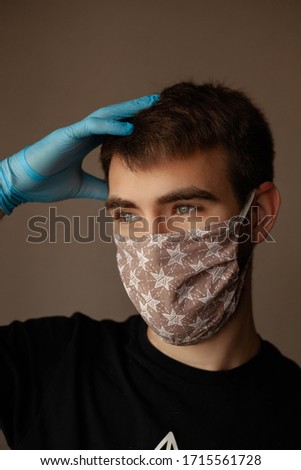 masked man portrait photo on a light background