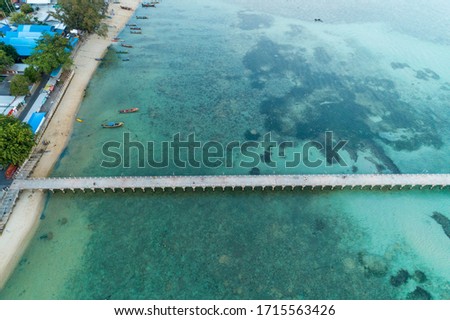 Aerial High angle view drone shot of long bridge in to the tropical sea