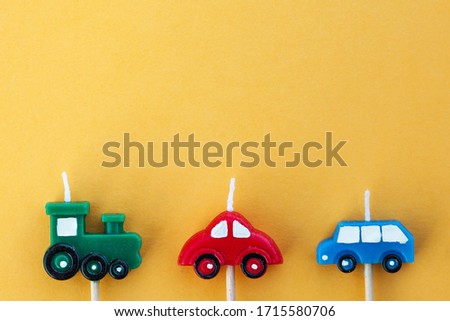  Multi-colored candle cars with space for text. The concept of children's holiday, International Children's Day. 
