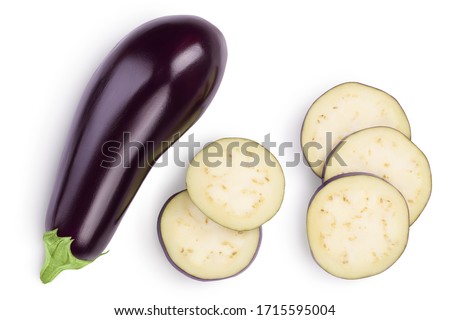 Eggplant or aubergine with slices isolated on white background. Clipping path and full depth of field. top, view, flat lay Royalty-Free Stock Photo #1715595004