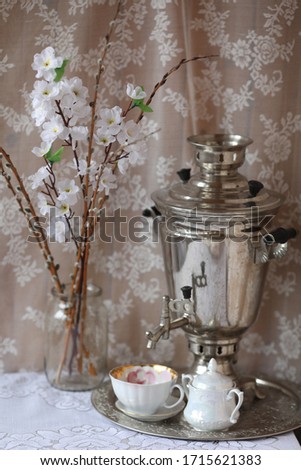 easter russian picture with samovar near flowers on the table