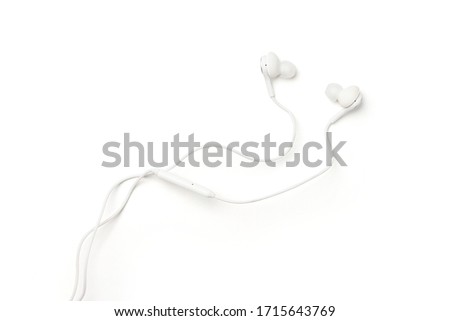 New white in-ear headphone isolated on white background. Clipping path.