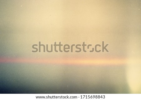 Abstract film texture background with heavy grain, dust and light leak
