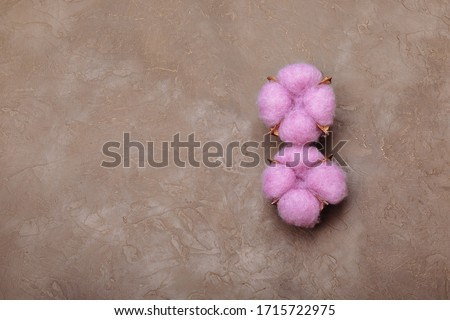 March 8. Happy Women's Day. Decorative pink bow on textured background. Cotton flowers are laid out in shape of number eight. International Women's Day Design Template.