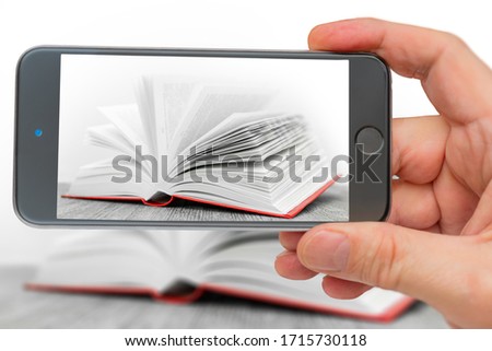 Book on smartphone screen. Big open book. Pages of new book. Training and Education on pages of books.
