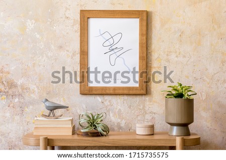 Stylish scandinavian interior of living room with mock up poster frame, wooden console, plants, airplant, books, decoration, grunge wall and elegant personal accessories in modern home decor.