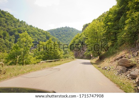 highway and mountain with beautiful clouds landscape. Mountain road between forests . Winding mountain road . A road in Azerbaijan between Forest . Empty road in mountainous area along mountains