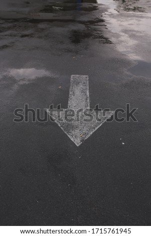 auxiliary lines in a parking lot after it rains