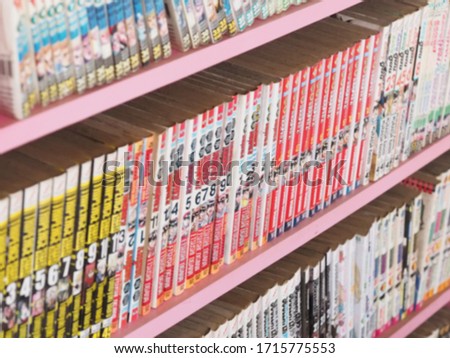 Comic books in bookshelf for background