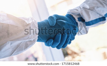 Cleaners  or Doctors handshake. Successful medical handshaking after  coronavirus (Coivd-19) epidemic. Business partnership medical  concept image Royalty-Free Stock Photo #1715812468