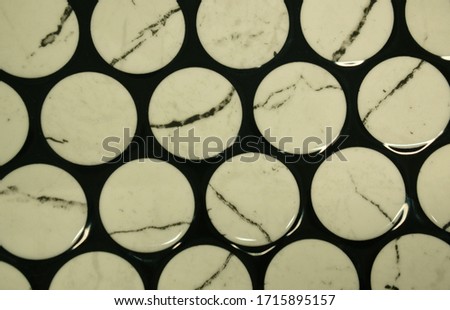 White ceramic circles tiles close up picture
