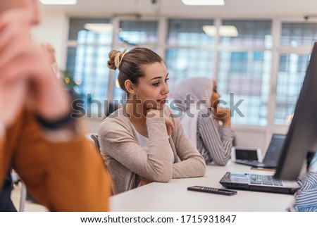 Portrait of a tired businesswoman  having a business meeting in the office. Royalty-Free Stock Photo #1715931847