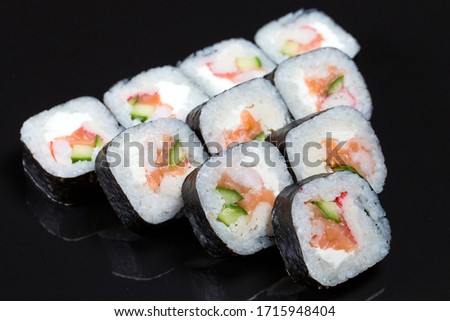Sushi rolls Futo Maki on a black background