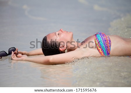 Girl on the beach on a sunny day