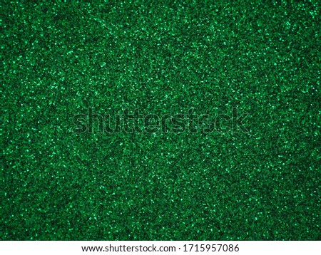 A glittery green paper. Silver glitter light bokeh abstract texture. Pattern designs. Sparkle wallpaper for Christmas. Brilliance shimmering sequin background. Party time. Royalty-Free Stock Photo #1715957086