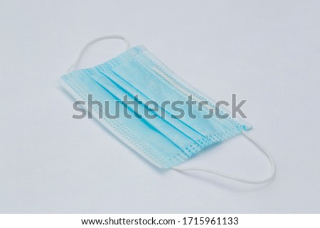 Protective sanitary mask in perspective on white background.