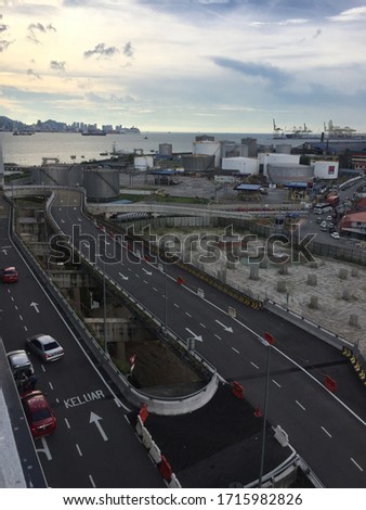 Road in busy city near port, leading line, Penang Malaysia