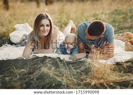 Family with cute little son. Father in a gray shirt. Family on a picnic