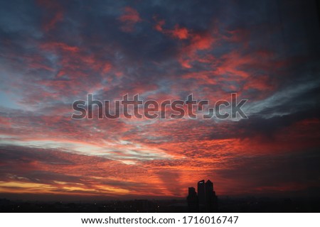 Natural Sunset Sunrise Over Field Or Meadow. Bright Dramatic Sky And Dark Ground. Countryside Landscape Under Scenic Colorful Sky At Sunset Dawn Sunrise. Sun Over Skyline, Horizon. Warm Colours. Royalty-Free Stock Photo #1716016747