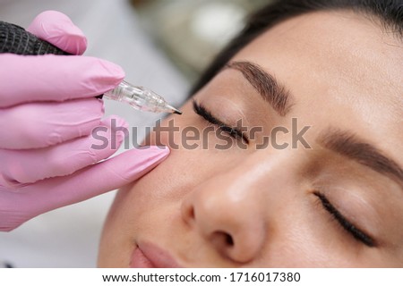 Permanent eyeliner tattoos enhancement coloring in spa professional service